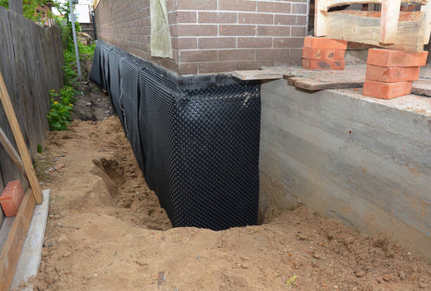 SJ Waterproofing Pros technician performing targeted Vapor Barrier Installation assessment in Lowell, WI